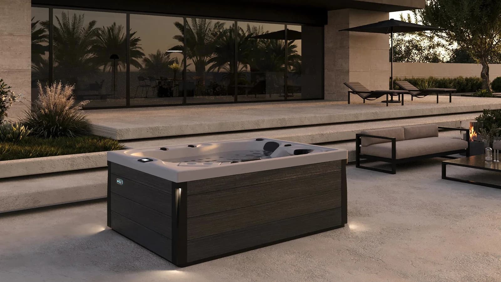 Platinum Spas Topaz hot tub on a stone patio beside a modern home