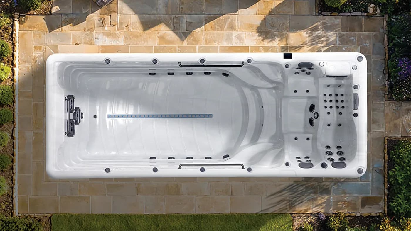 Overhead view of a Platinum Spas Zelus swim spa set into a garden patio