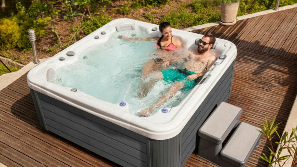 6-person hot tub with couple soaking in the water