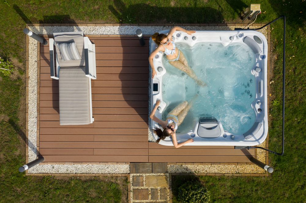 luxury hot tubs - two friends hanging out in their hot tub